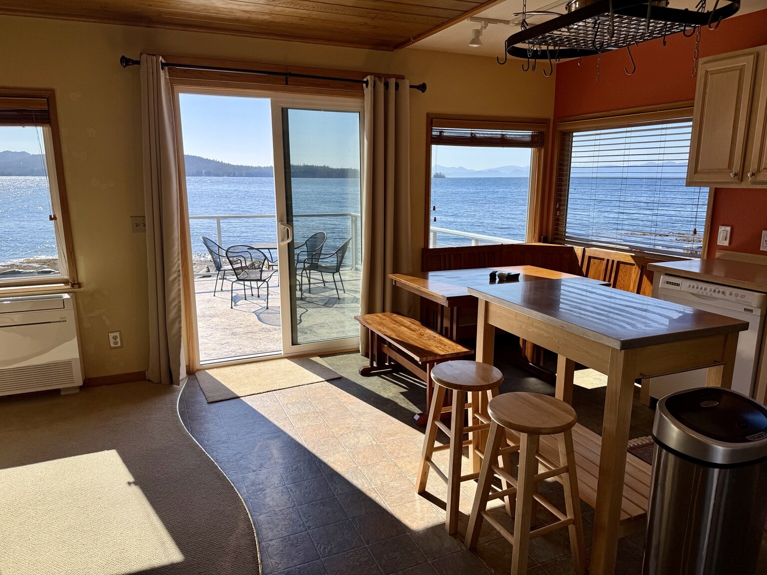Kitchen and dining area opening onto the waterfront deck