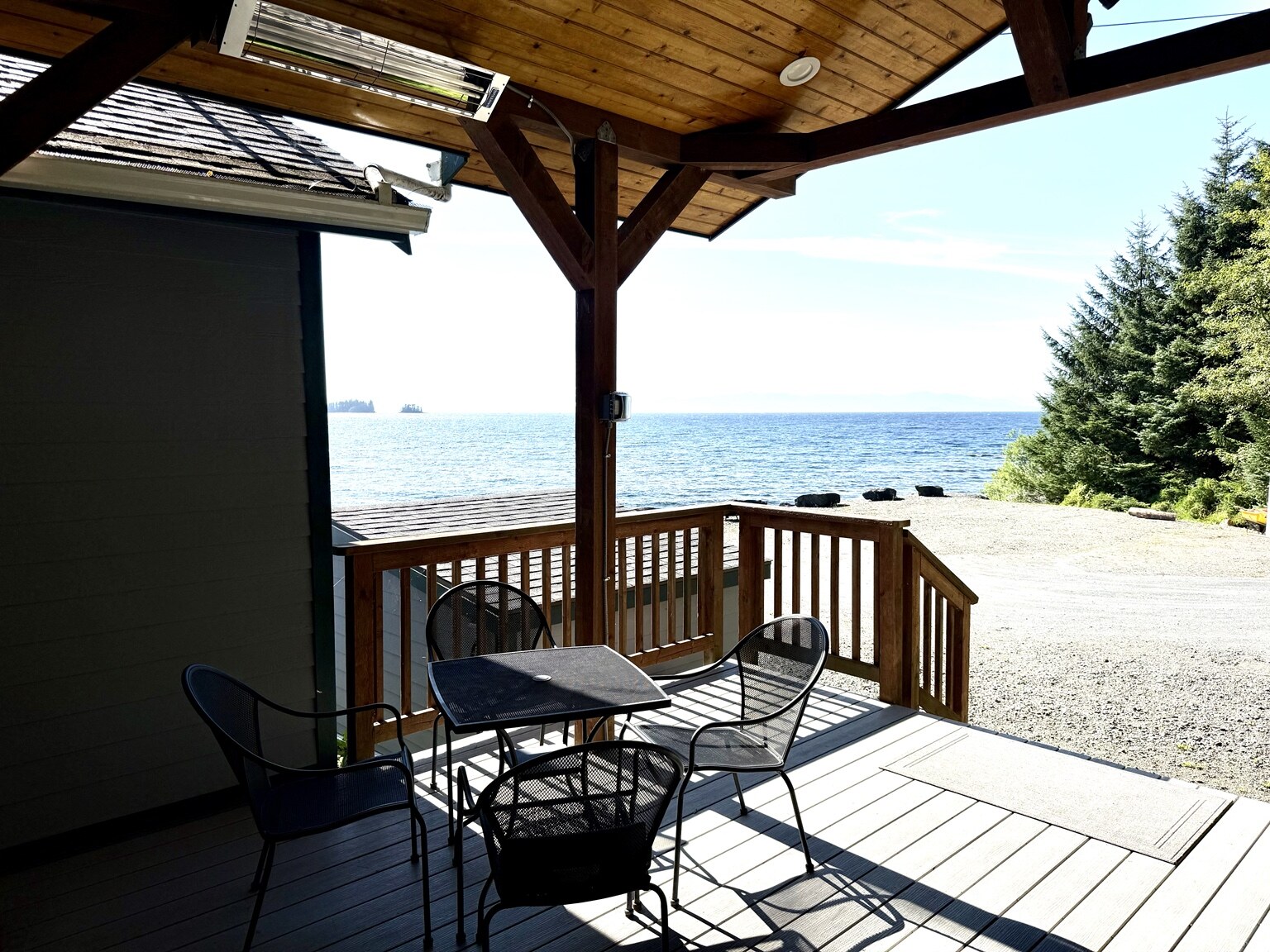 Covered outdoor dining deck with grill and heaters