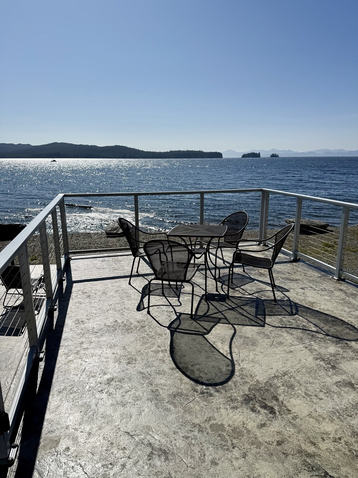 Ocean-facing deck overlooking the water and mountains